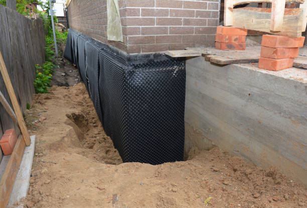 Happy homeowners after waterproofing job in West Creek
